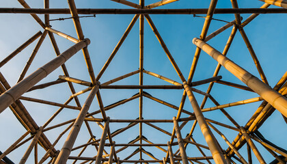 Fototapeta premium Low angle view of sustainable bamboo roof structure geometric pattern