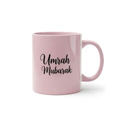 Illustration of pink coffee mug with umrah mubarak text on isolated white background