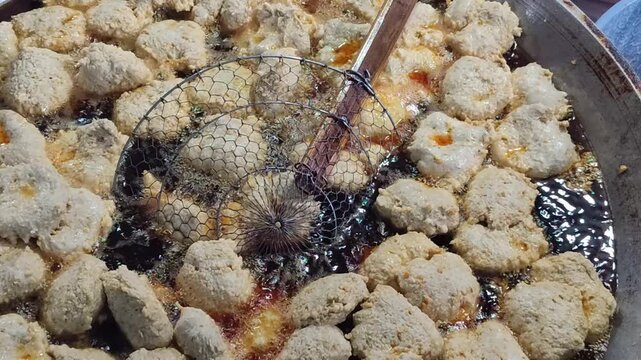 Pempek is fried and served with a sweet and sour sauce called kuah muka (vinegar sauce). Pempek is an Indonesian (Palembang) dish.