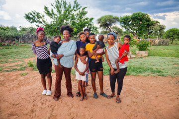 african village large family group, poverty, outdoors village home in rural Botswana outdoors