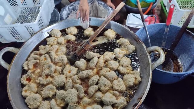 Pempek is fried and served with a sweet and sour sauce called kuah muka (vinegar sauce). Pempek is an Indonesian (Palembang) dish.