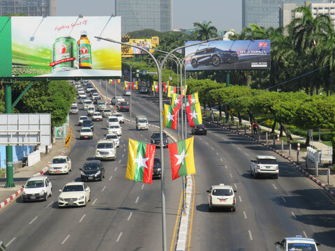 Myanmar Flags Flying Above a Highway During the 2025 Elections