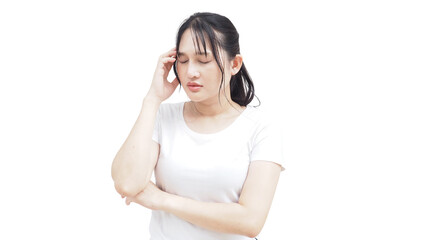 Asian woman standing with crossed arms and touching her head, expressing migraine pain and mental strain. This photo represents stress, exhaustion, nervous tension, and general wellness awareness.