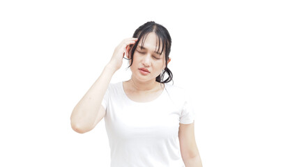Naklejka premium Asian female holding her head with a tired facial expression, indicating ache and discomfort. The image highlights illness symptoms, anxiety, tension, and overall healthcare awareness.