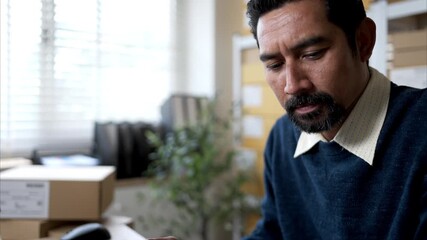 Warehouse manager analyzing data on desktop computer, planning inventory and business operations in storage office - Powered by Adobe