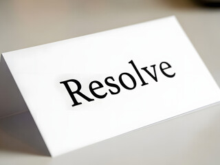 Word resolve on white paper with soft focus background