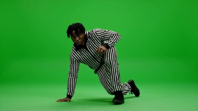 Artistic black silhouette illustration of a young male dancer in action and a sport player moving to music vector