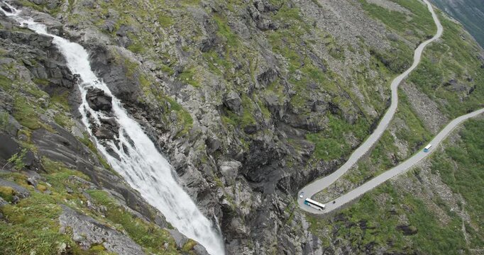 Bus driving on trollstigen serpentine mountain road in norway