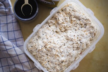 Artisan Bread with Seeds on Wooden Cutting Board