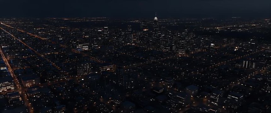 Aerial view of metropolitan city night lights experiencing power outage