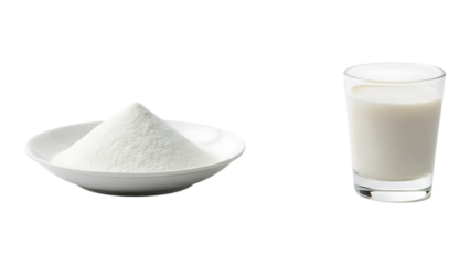 A pristine white plate holds a mound of sugar beside a glass of creamy white milk isolated