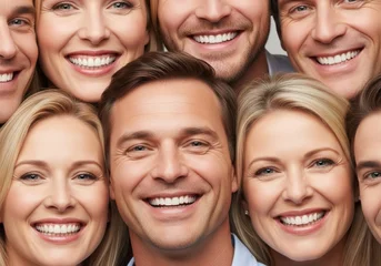 Ingelijste posters Tandarts Group of happy caucasian men and women smiling warmly at the camera. Diverse people with perfect white teeth for dental health or family concept.  © Tiana_Geo