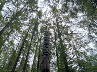 Fototapeta premium Trader Legend Pole in Sitka National Historical Park in Sitka, Alaska in Summer