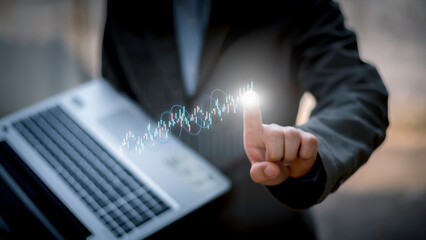 Businessman analyzing stock market data with digital candlestick chart, investment and opportunity concept, trading strategy, financial growth, business and enterprise analysis.