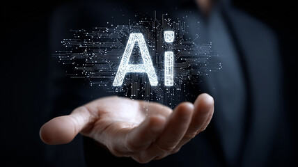 Glowing artificial intelligence letters hovering above an open human hand illustrating AI technology innovation and digital intelligence concepts.
