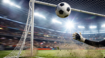 Dynamic Football Goalie Action at a Packed Stadium Match