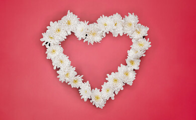 White Flowers Heart on Pink Paper Surface. File with Clipping Path.