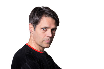 Middle-aged man in casual clothes on white background, looking at the camera.