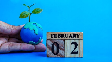 World wetlands day concept with earth and growing plant
