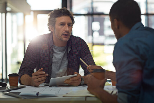 Team, architect and tablet with blueprint, talk and flare for property development with report at office. People, tech and floor plan for design, solution or app for real estate expansion at agency - Powered by Adobe