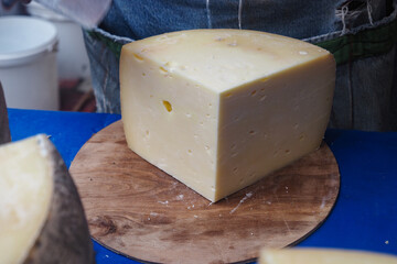 Cheese block on display at market during daytime hours