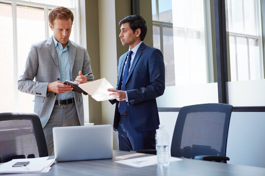Businessman, document and assistant writing in meeting for reporting, auditing support or notes. Team, financial manager and people with planning in office for budget management and operational tasks
