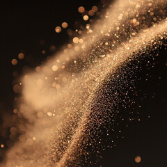 Golden glitter dust and soft bokeh lights shimmer and flow dynamically across a dark background, creating an abstract luminous effect