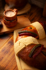 Rosca de Reyes, also called Three Kings Bread, Roscon, Epiphany Cake, traditionally served with hot chocolate in a clay Jarrito. Mexican tradition on January 5th.