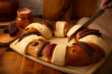 Rosca de Reyes, also called Three Kings Bread, Roscon, Epiphany Cake, traditionally served with hot chocolate in a clay Jarrito. Mexican tradition on January 5th.