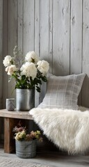 Rustic flowers & textiles on a wooden bench by a wall