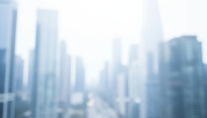 白色基調の背景画像　強いソフトフォーカスのイメージ画像　ぼやけた都会のビル街の風景　ビジネス用背景素材　強い背景ボケ