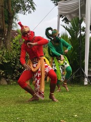 Traditional dancers perform vibrant outdoor routine in colorful costumes