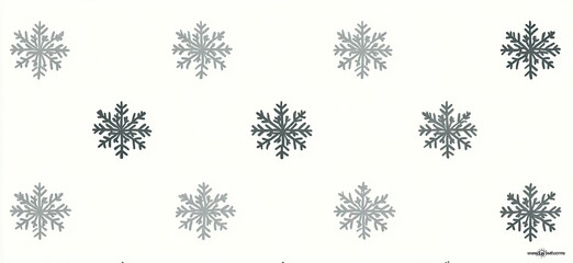 Snowflakes scattered across white, some darker, in rows & columns