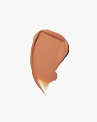 Smooth caramel colored foundation smear on white background