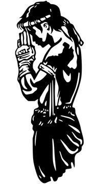 Black silhouette of a Muay Thai fighter performing the traditional Wai Khru Ram Muay ritual.