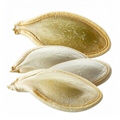 Close-up of three shelled and one unshelled seed, isolated white
