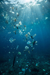 Fototapeta premium Underwater ocean plastic pollution with floating garbage, environmental crisis concept
