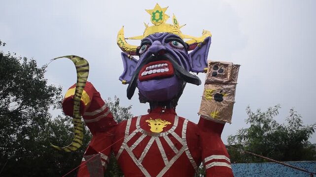 Ravnans being ignited during Dussehra festival at ramleela ground in Delhi, India, Big statue of Ravana to get fire during the Fair of Dussera to celebrate the victory of truth by Lord Rama