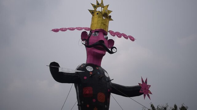 Ravnans being ignited during Dussehra festival at ramleela ground in Delhi, India, Big statue of Ravana to get fire during the Fair of Dussera to celebrate the victory of truth by Lord Rama
