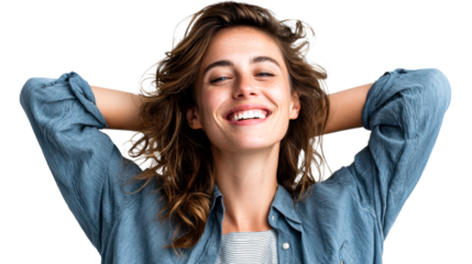 Cheerful young woman with brown wavy hair and freckles smiling broadly with her hands behind her head conveying confident and relaxed emotions ideal for lifestyle and wellness promotions