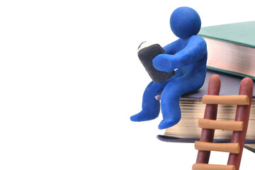 A man sits on the stairs and reads a book isolated