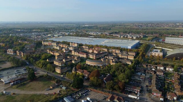 Aerial drone view of suburban housing on hills in Purfleet on Thames, golden hour sunset UK