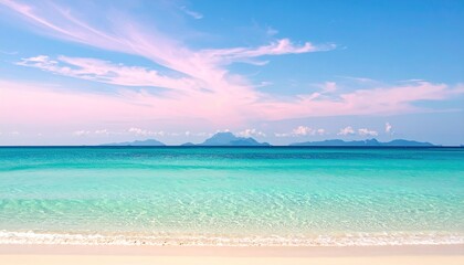 Fototapeta premium Serene beach scene featuring turquoise water, white sand, and a blue sky