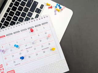 multiple push pins marked on monthly calendar 2026 for business events, schedule, appointment, reminder, planner, organise, agenda, deadline, last date concept