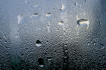 Drops of morning dew on the glass.