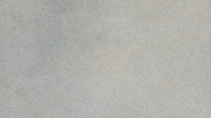 Concrete floor mixed with gray and beige gravel, road texture, walkway texture, small gravel road surface, tactile surface, and background.