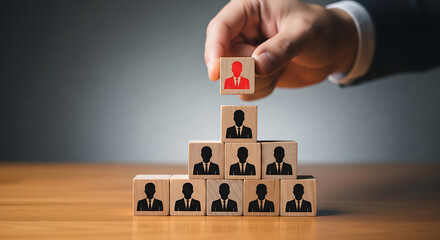 Leadership concept with red leader block standing out from crowd