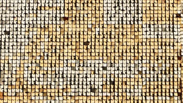 Golden shimmering sequin wall creating a vibrant festive glitter background