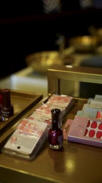 Salon tray with nail art brushes, polishes, buffers, and a bowl of cotton balls neatly arranged