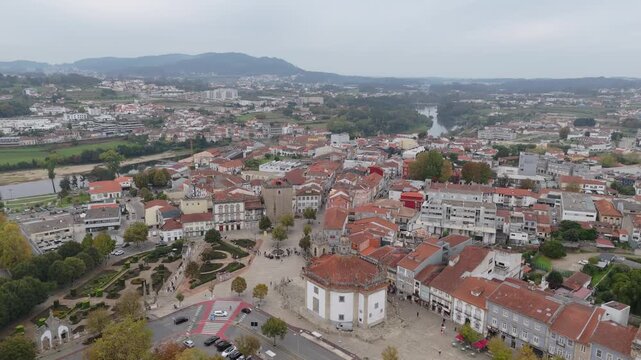 Aerial view of Barcelos town center with square buildings and river